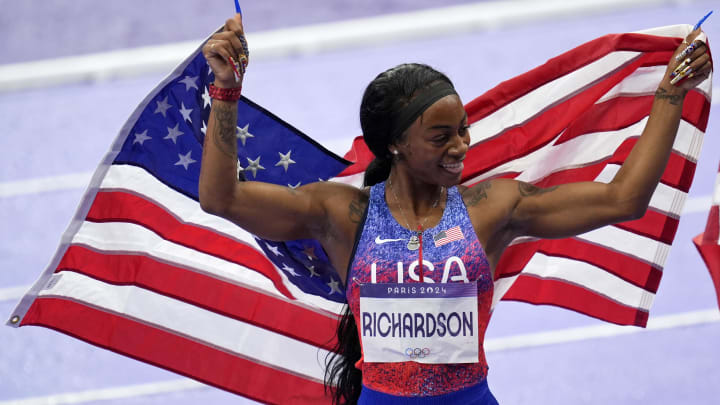 Aug 9, 2024; Paris Saint-Denis, France; Sha'carri Richardson (USA) celebrates after winning the womenís 4x100m relay during the Paris 2024 Olympic Summer Games at Stade de France. 