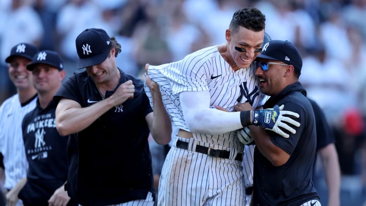 Jun 26, 2022; Bronx, New York, USA; New York Yankees center fielder Aaron Judge (99) celebrates his game winning walk off three run home run against the Houston Astros with starting pitchers Gerrit Cole (45) and Nestor Cortes (65) during the tenth inning at Yankee Stadium. Mandatory Credit: Brad Penner-USA TODAY Sports