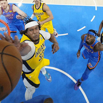 Jun 22, 2025; Oklahoma City, Oklahoma, USA; Indiana Pacers center Myles Turner (33) reaches for the ball against the Oklahoma City Thunder during the first half of game seven of the 2025 NBA Finals at Paycom Center. Mandatory Credit: Kyle Terada-Imagn Images