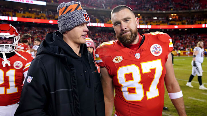 Cincinnati Bengals quarterback Joe Burrow (9), left, talks with Kansas City Chiefs tight end Travis Kelce (87) at the conclusion of a Week 17 NFL football game between the Cincinnati Bengals and the Kansas City Chiefs, Sunday, Dec. 31, 2023, at GEHA Field at Arrowhead Stadium in Kansas City, Mo. The Kansas City Chiefs won, 25-17.