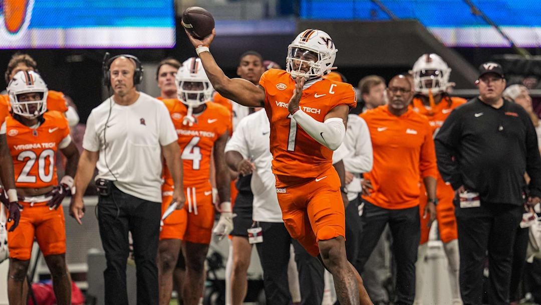 Aug 31, 2025; Atlanta, Georgia, USA; Virginia Tech Hokies quarterback Kyron Drones (1) passes the ball against the South Carolina Gamecocks during the first quarter at Mercedes-Benz Stadium. Mandatory Credit: Dale Zanine-Imagn Images
