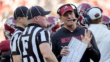 Nov 16, 2024; Tuscaloosa, AL, USA; Alabama Crimson Tide head coach Kalen DeBoer talks with officials during a review during the game against the Mercer Bears at Bryant-Denny Stadium. Mandatory Credit: Gary Cosby Jr.-Imagn Images
