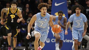 Jan 28, 2025; Pittsburgh, Pennsylvania, USA;  North Carolina Tar Heels guard Seth Trimble (7) brings the ball up court on a fast break against the Pittsburgh Panthers during the second half at the Petersen Events Center. Mandatory Credit: Charles LeClaire-Imagn Images