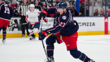 Oct 5, 2023; Columbus, Ohio, USA;  Columbus Blue Jackets defenseman Jake Christiansen (23) shoots the puck against the Washington Capitals in the second period at Nationwide Arena. Mandatory Credit: Aaron Doster-USA TODAY Sports