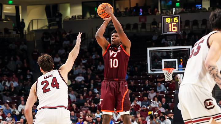 Dec 2, 2025; Columbia, South Carolina, USA; Virginia Tech Hokies guard Tyler Johnson (10) shoots over South Carolina Gamecocks forward Nordin Kapic (24) in the second half at Colonial Life Arena. Mandatory Credit: Jeff Blake-Imagn Images