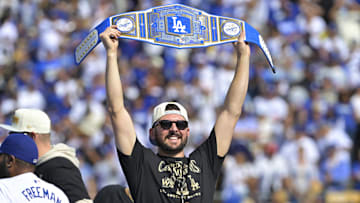 Nov 1, 2024; Los Angeles, CA, USA;  Los Angeles Dodgers pitcher Alex Vesia (51) addresses fans during the World Series Championship Celebration at Dodger Stadium. Mandatory Credit: Jayne Kamin-Oncea-Imagn Images