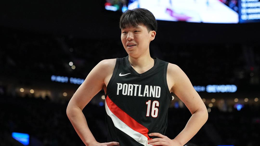 Feb 7, 2026; Portland, Oregon, USA; Portland Trail Blazers center Yang Hansen (16) reacts to a call during the first half against the Memphis Grizzlies at Moda Center. Mandatory Credit: Soobum Im-Imagn Images