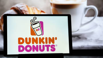 In this photo illustration, a Dunkin Donuts (Dunkin Brands...