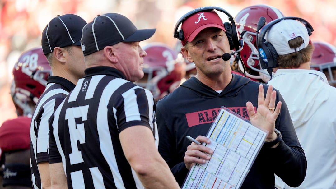 Nov 16, 2024; Tuscaloosa, AL, USA; Alabama Crimson Tide head coach Kalen DeBoer talks with officials during a review at Bryant-Denny Stadium. Alabama defeated Mercer 52-7. Mandatory Credit: Gary Cosby Jr.-Tuscaloosa News