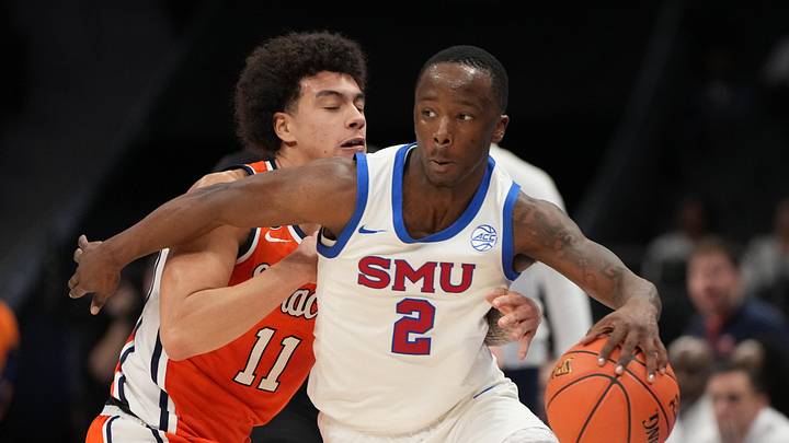 Mar 10, 2026; Charlotte, NC, USA; Southern Methodist University Mustangs guard Boopie Miller (2) with the ball as Syracuse Orange guard Naithan George (11) defends in the second half at Spectrum Center. Mandatory Credit: Bob Donnan-Imagn Images