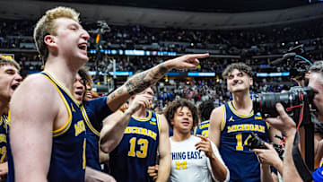 Michigan Wolverines celebrate their win against Texas A&M Aggies in the second round of the NCAA tournament at Ball Arena in Denver, Colorado, Saturday, March 22, 2025.