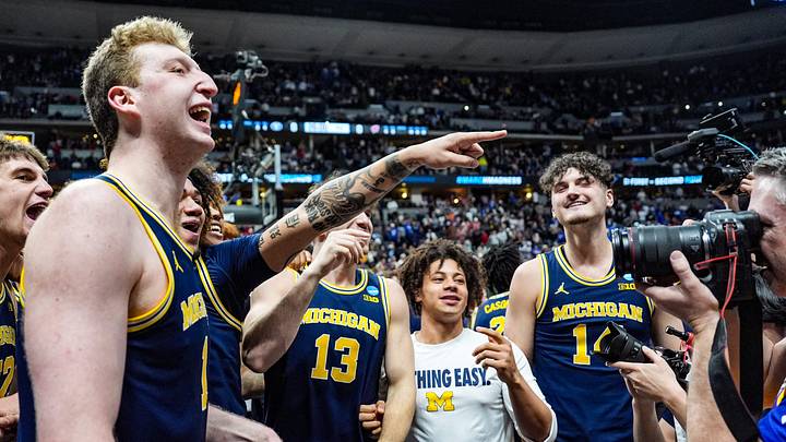 Michigan Wolverines celebrate their win against Texas A&M Aggies in the second round of the NCAA tournament at Ball Arena in Denver, Colorado, Saturday, March 22, 2025.