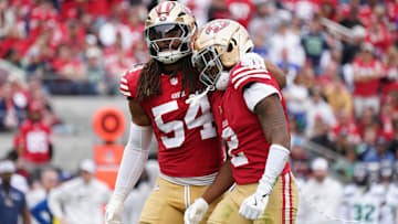 San Francisco 49ers linebacker Fred Warner (54) calms down San Francisco 49ers cornerback Deommodore Lenoir (2) after offsetting penalties against the Seattle Seahawks in the second quarter at Levi's Stadium.