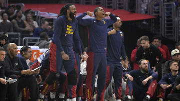 Apr 4, 2024; Los Angeles, California, USA;  Denver Nuggets center DeAndre Jordan (6) and forward Peyton Watson (8) react after a basket in the first half against the Los Angeles Clippers at Crypto.com Arena. 
