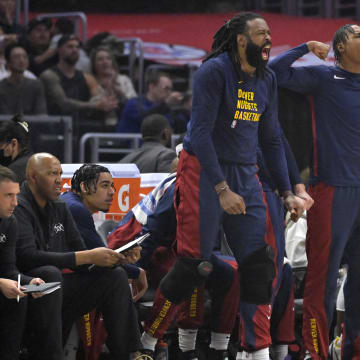 Apr 4, 2024; Los Angeles, California, USA;  Denver Nuggets center DeAndre Jordan (6) and forward Peyton Watson (8) react after a basket in the first half against the Los Angeles Clippers at Crypto.com Arena. 