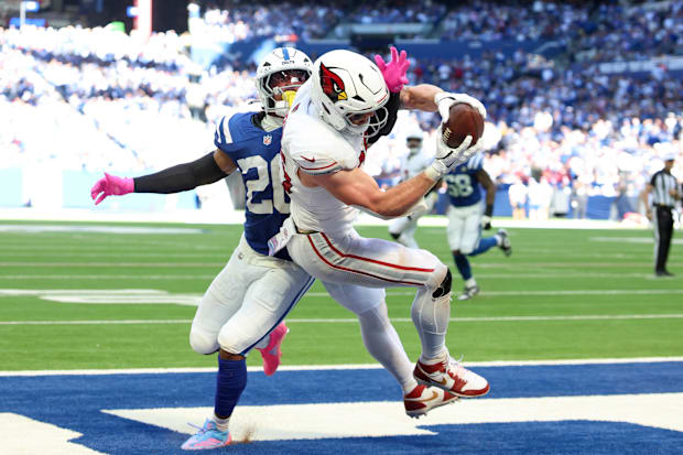 Arizona Cardinals tight end Trey McBride makes a reception for a touchdown defended by Indianapolis Colts safety Nick Cross.