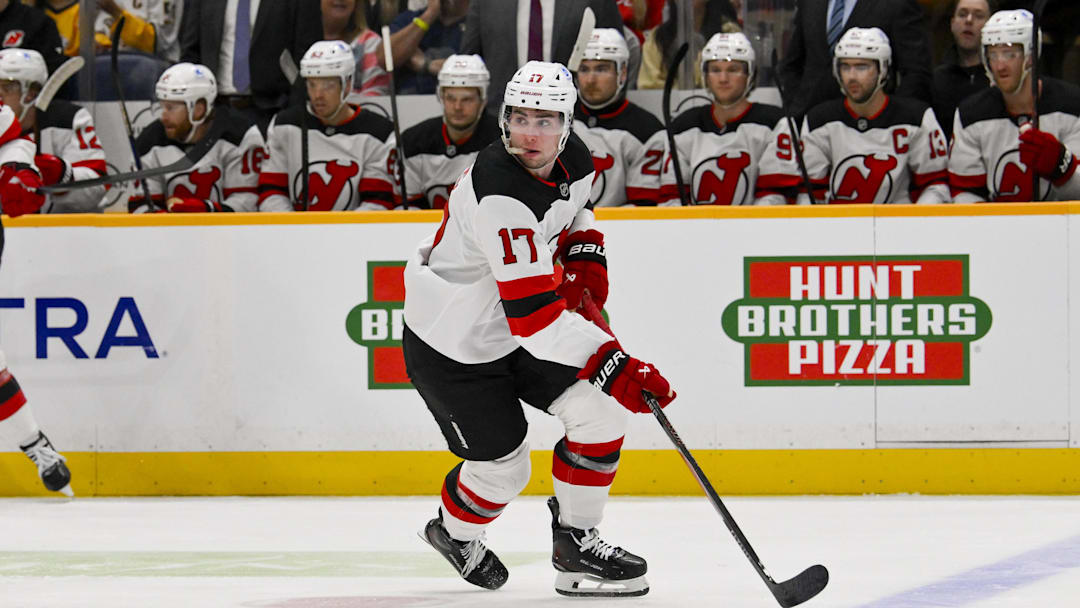 Mar 26, 2026; Nashville, Tennessee, USA;  New Jersey Devils defenseman Simon Nemec (17) skates with the puck against the Nashville Predators during the first period at Bridgestone Arena. Mandatory Credit: Steve Roberts-Imagn Images