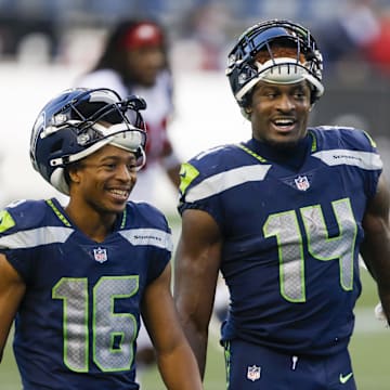 Nov 1, 2020; Seattle, Washington, USA; Seattle Seahawks wide receiver Tyler Lockett (16) and wide receiver DK Metcalf (14) return to the locker room following a 37-27 victory against the San Francisco 49ers at CenturyLink Field. Mandatory Credit: Joe Nicholson-Imagn Images