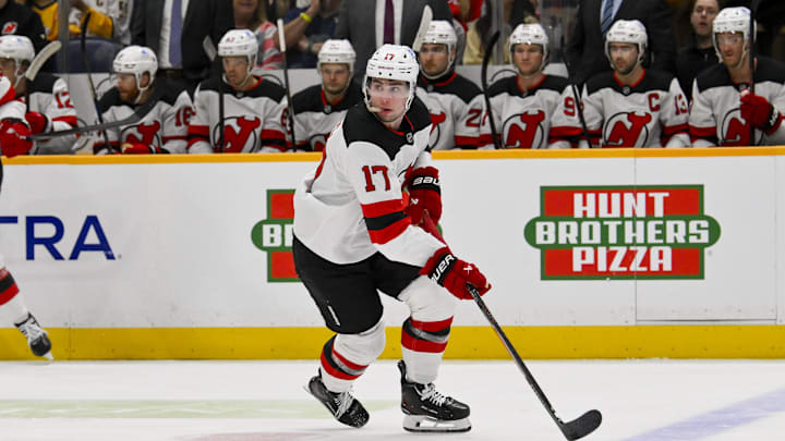 Mar 26, 2026; Nashville, Tennessee, USA;  New Jersey Devils defenseman Simon Nemec (17) skates with the puck against the Nashville Predators during the first period at Bridgestone Arena. Mandatory Credit: Steve Roberts-Imagn Images