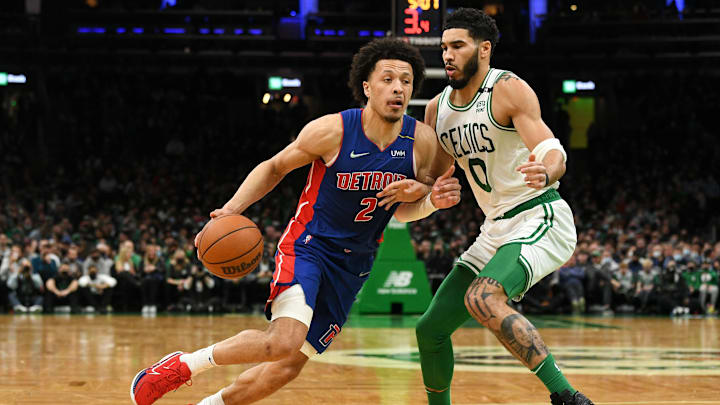 Feb 16, 2022; Boston, Massachusetts, USA; Detroit Pistons guard Cade Cunningham (2) drives to the basket against Boston Celtics forward Jayson Tatum (0) during the first half at the TD Garden. Mandatory Credit: Brian Fluharty-Imagn Images