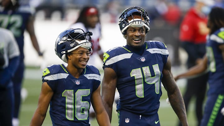 Nov 1, 2020; Seattle, Washington, USA; Seattle Seahawks wide receiver Tyler Lockett (16) and wide receiver DK Metcalf (14) return to the locker room following a 37-27 victory against the San Francisco 49ers at CenturyLink Field. Mandatory Credit: Joe Nicholson-Imagn Images