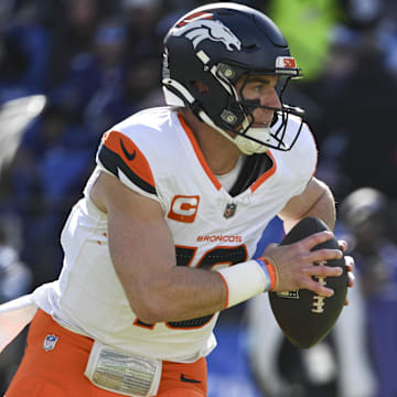 Nov 3, 2024; Baltimore, Maryland, USA; Denver Broncos quarterback Bo Nix (10) runs during the first half against the Baltimore Ravens at M&T Bank Stadium. 