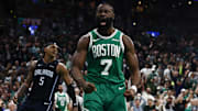 Boston Celtics guard Jaylen Brown (7) shouts out after dunking as Orlando Magic forward Paolo Banchero (5) turns away during the second half of game two of the first round of the 2024 NBA Playoffs at TD Garden.