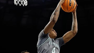 Mar 15, 2025; Fort Worth, TX, USA;  UAB Blazers forward Christian Coleman (4) grabs a rebound against North Texas Mean Green forward Grant Newell (8) during the first half at Dickies Arena. Mandatory Credit: Chris Jones-Imagn Images
