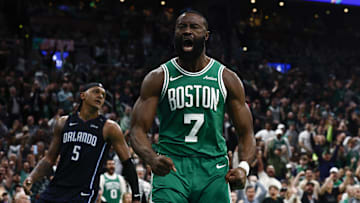Apr 23, 2025; Boston, Massachusetts, USA; Boston Celtics guard Jaylen Brown (7) shouts out after dunking as Orlando Magic forward Paolo Banchero (5) turns away during the second half of game two of the first round of the 2024 NBA Playoffs at TD Garden. Mandatory Credit: Winslow Townson-Imagn Images