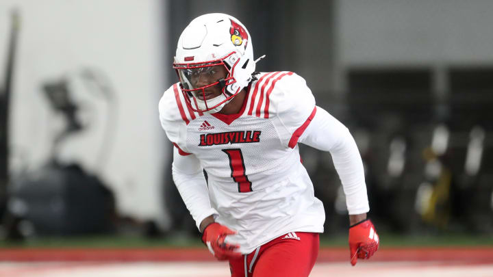 Louisville’s Ja'Corey Brooks (1) runs to catch the ball during Spring Practice on Thursday.