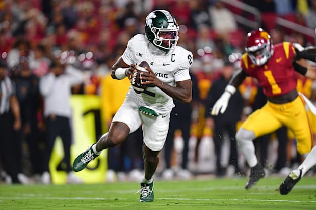 Michigan State Spartans quarterback Aidan Chiles (2) moves out to pass against the Southern California Trojans 