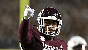 Nov 16, 2024; College Station, Texas, USA; Texas A&M Aggies tight end Tre Watson (84) motions during the first quarter against the New Mexico State Aggies at Kyle Field. Mandatory Credit: Maria Lysaker-Imagn Images 