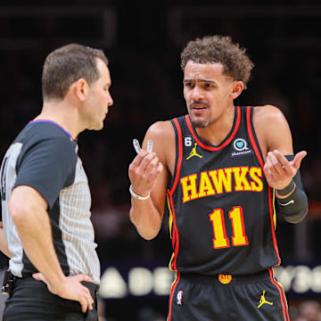 Feb 28, 2023; Atlanta, Georgia, USA; Atlanta Hawks guard Trae Young (11) talks to referee Brian Forte (45) against the Washington Wizards in the second half at State Farm Arena. Mandatory Credit: Brett Davis-Imagn Images