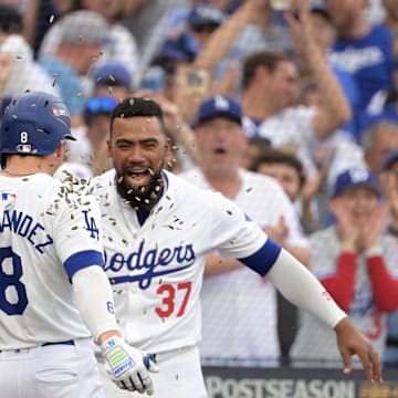 Oct 11, 2024; Los Angeles, California, USA; Los Angeles Dodgers third baseman Enrique Hernandez (8) celebrates with shortstop Mookie Betts (50) and designated hitter Shohei Ohtani (17) and outfielder Teoscar Hernandez (37) after hitting a solo home run in the second inning against the San Diego Padres during game five of the NLDS for the 2024 MLB Playoffs at Dodger Stadium. Mandatory Credit: Jayne Kamin-Oncea-Imagn Images