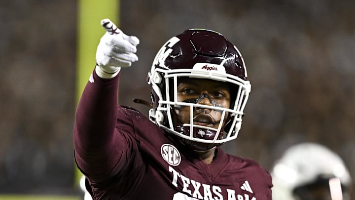 Nov 16, 2024; College Station, Texas, USA; Texas A&M Aggies tight end Tre Watson (84) motions during the first quarter against the New Mexico State Aggies at Kyle Field. Mandatory Credit: Maria Lysaker-Imagn Images 