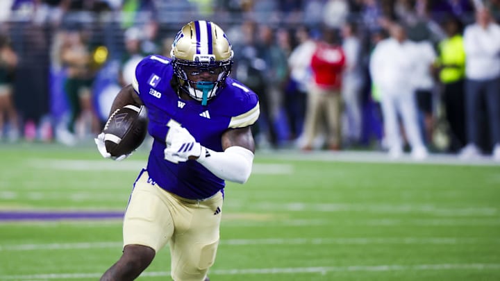 Aug 30, 2025; Seattle, Washington, USA; Washington Huskies running back Jonah Coleman (1) rushes for a touchdown against the Colorado State Rams during the first quarter at Husky Stadium. Mandatory Credit: Joe Nicholson-Imagn Images