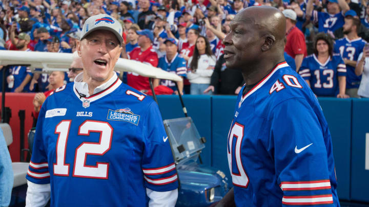 Sep 19, 2022; Orchard Park, New York, USA; Buffalo Bills former players Jim Kelly (left) and Bruce Smith on the field before a game between the Buffalo Bills and the Tennessee Titans at Highmark Stadium. Mandatory Credit: Mark Konezny-USA TODAY Sports