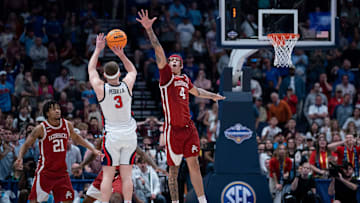 Mississippi Rebels guard Sean Pedulla (3) shoots over Arkansas Razorbacks forward Trevon Brazile (4) for the game-winning shot during their second round game of the SEC Men's Basketball Tournament at Bridgestone Arena in Nashville, Tenn., Thursday, March 13, 2025. The Rebels advanced to the third round with the 83-80 win.