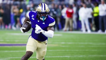 Aug 30, 2025; Seattle, Washington, USA; Washington Huskies running back Jonah Coleman (1) rushes for a touchdown against the Colorado State Rams during the first quarter at Husky Stadium. Mandatory Credit: Joe Nicholson-Imagn Images