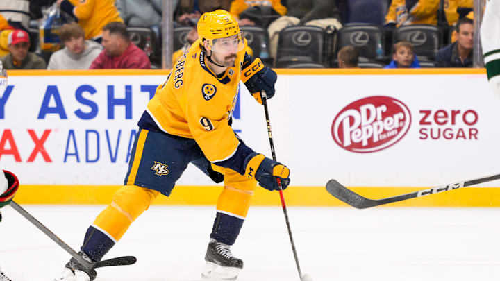 Jan 18, 2025; Nashville, Tennessee, USA;  Nashville Predators left wing Filip Forsberg (9) skates with the puck against the Minnesota Wild during the third period at Bridgestone Arena. Mandatory Credit: Steve Roberts-Imagn Images