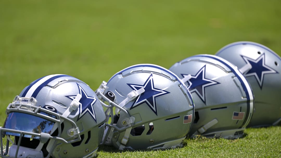 Jul 26, 2023; Oxnard, CA, USA; General view of player helmets on the field during training camp at River Ridge Playing Fields in Oxnard, CA. Mandatory Credit: Jayne Kamin-Oncea-Imagn Images