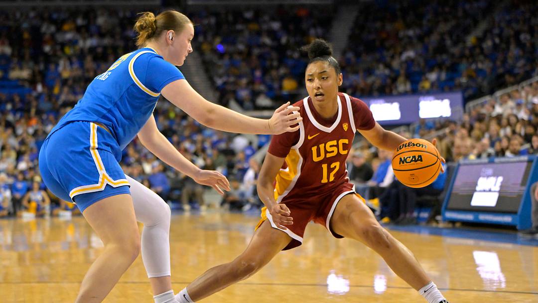 Dec 30, 2023; Los Angeles, California, USA;  USC Trojans guard JuJu Watkins (12) is defended by UCLA Bruins forward Lina Sontag (21) in the second half at Pauley Pavilion presented by Wescom. Mandatory Credit: Jayne Kamin-Oncea-USA TODAY Sports