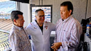 Oct 5, 2022; Los Angeles, California, USA; Retiring Spanish-language broadcaster Jaime Jarrin (center) talks with Pepe Yniguez (left) and Fernando Valenzuela (right) prior to the game against the Colorado Rockies at Dodger Stadium. Valenzuela and Yniguez will be the Spanish broadcast team for SportsNet LA.