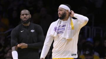 Dec 28, 2023; Los Angeles, California, USA; Los Angeles Lakers forward LeBron James (23) and forward Anthony Davis (3) look on from the bench in the fourth quarter against the Charlotte Hornets at Crypto.com Arena. Mandatory Credit: Jayne Kamin-Oncea-USA TODAY Sports