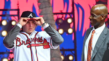 Jul 17, 2022; Los Angeles, CA, USA;  Former Atlanta Braves player Fred McGriff presents JR Ritchie right with his jersey after he was selected by the Atlanta Braves as the 35th pick of the MLB draft at XBox Plaza at LA Live. Mandatory Credit: Jayne Kamin-Oncea-Imagn Images
