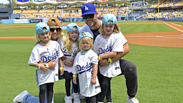 Los Angeles Rams quarterback Matthew Stafford with his wife Kelly with their 4 daughters on the field prior to the game between the Los Angeles Dodgers and the Atlanta Braves at Dodger Stadium.