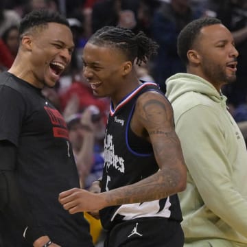 Mar 23, 2023; Los Angeles, California, USA; Los Angeles Clippers guard Bones Hyland (5) is congratulated by guard Russell Westbrook (0) after a 3 point basket in the second half against the Oklahoma City Thunder at Crypto.com Arena. 