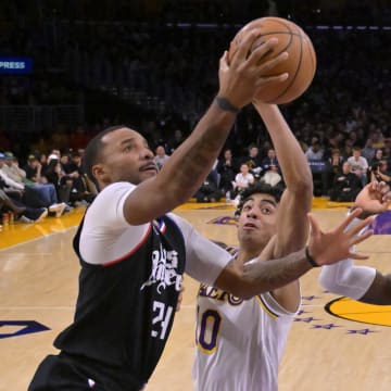 Jan 7, 2024; Los Angeles, California, USA;  Los Angeles Clippers guard Norman Powell (24) drives past Los Angeles Lakers guard Max Christie (10) in the second half at Crypto.com Arena. Mandatory Credit: