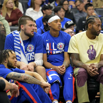 Apr 20, 2023; Los Angeles, California, USA; Los Angeles Clippers forward Kawhi Leonard (2) looks on from the bench in the first half against the Phoenix Suns at Crypto.com Arena. 