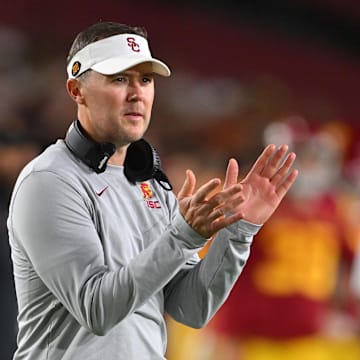 Oct 1, 2022; Los Angeles, California, USA;  USC Trojans head coach Lincoln Riley applauds after a touchdown in the first half against the Arizona State Sun Devils at United Airlines Field at the Los Angeles Memorial Coliseum. Mandatory Credit: Jayne Kamin-Oncea-Imagn Images